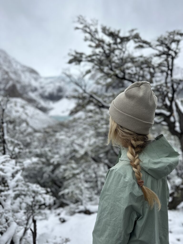 woman wearing cold weather hiking layers. 